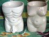 PAIR OF NAUGHTY MAN AND LADY POTTERY EGG CUPS 
